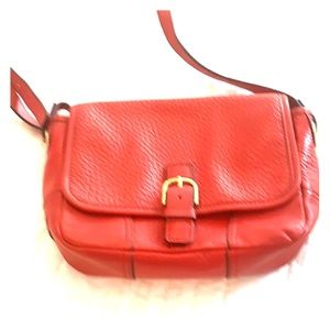 Coach cross body bag in red.